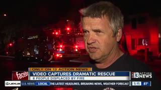 Woman rescued by firefighters from burning building
