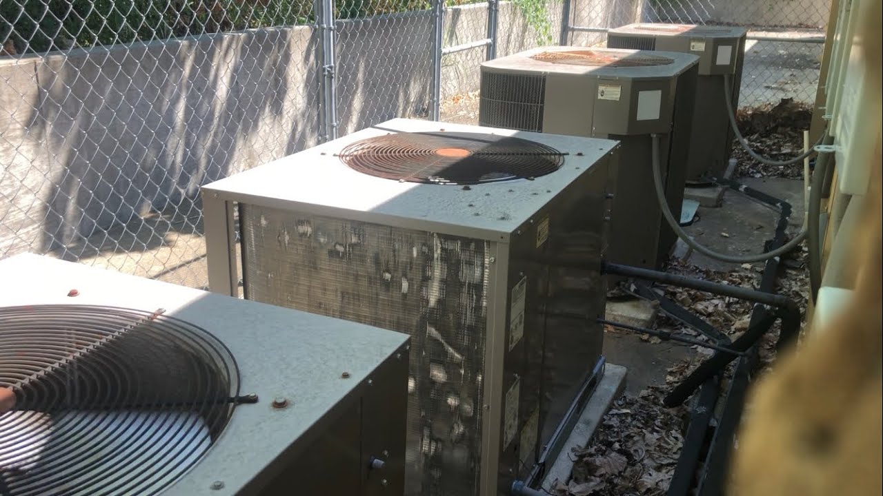 2 Luxaire air conditioners starting up and 2 Luxaire air conditioners