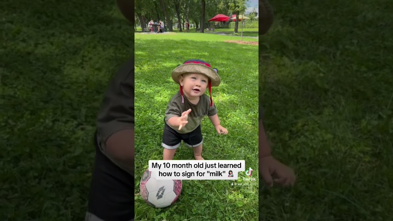 Baby using sign language to ask for milk 