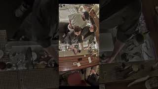 Guy Causes Water to Spray a Person Sitting at a Bar Unintentionally
