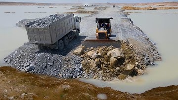 Awesome Team Dump Truck Moving Stone and Bulldozer Push Stone Build Road on the Deep Pit