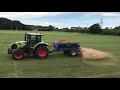 Sports pitch maintenance  spreading sand topdressing