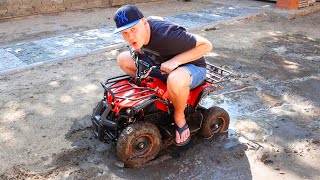 daddy stuck in the mud on power wheels quadbike