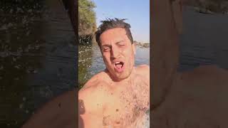 Swimming In The Nile River Between Crocodiles
