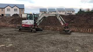 Takeuchi tb260 with Rototilt and grading beam