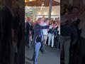 Peter Dutton has played two-up with a raucous crowd at the Townsville RSL.