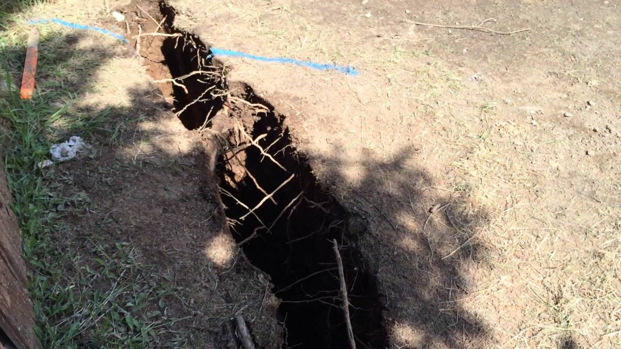 Slot trenching around structure