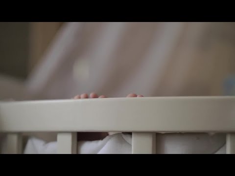 Baby Lying In The Crib Stock Video