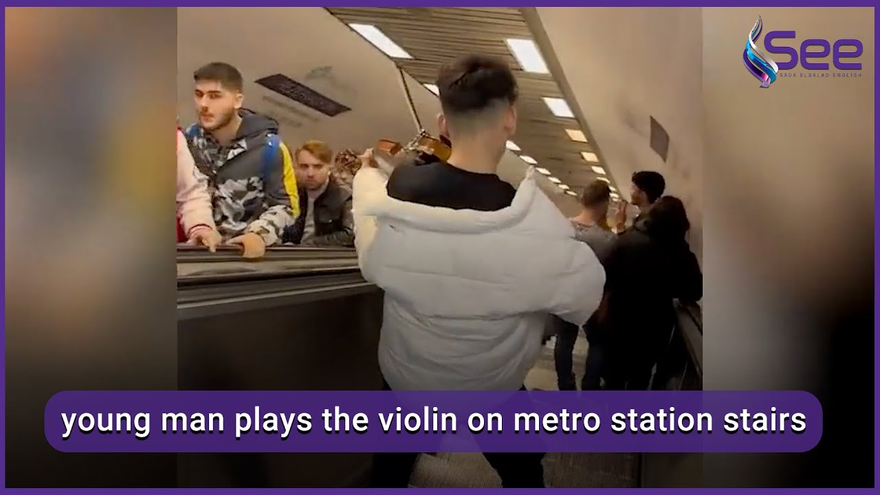 young man plays the violin on metro station stairs 1 YouTube