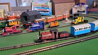 Bachmann custom Duke pulling 4 blue coaches 