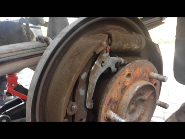 Wheel lug stud repair and stuck brake drum removal - YouTube