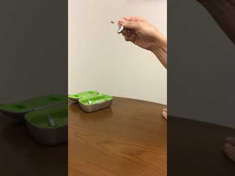 Removing a Phonak hearing aid from the charger