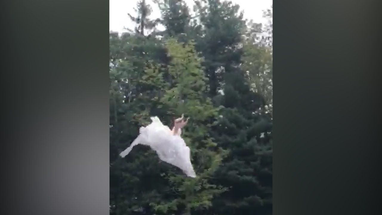 This out-of-the box bride 'blobs' into a lake in her wedding dress