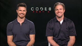 CODE 8: PART II Interview! Robbie Amell &amp; Stephen Amell talk growing up together, HEELS! Netflix