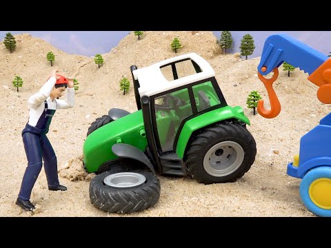 Juega con coches de juguete para rescatar tractores con ruedas rotas