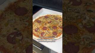 Dog thinks she’ll get a piece of pizza
