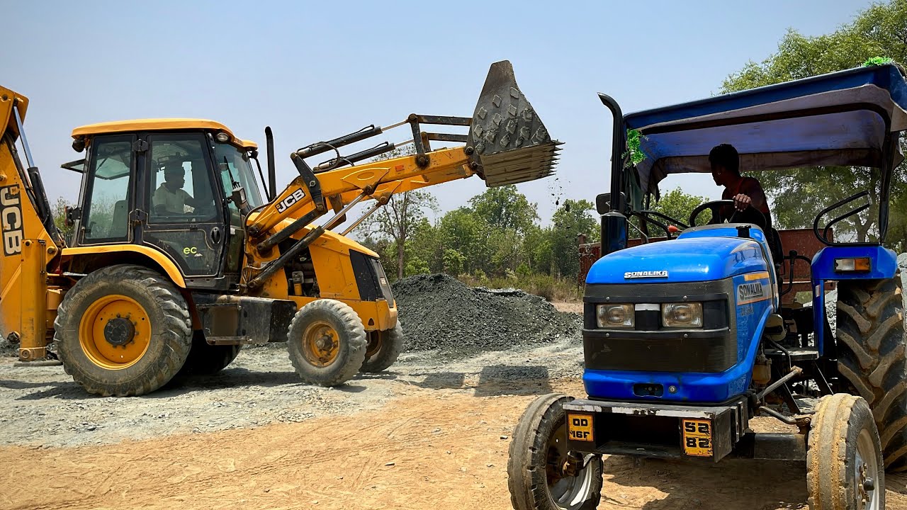 JCB 3DX Backhoe Loader Loading Mixed Ballast In Sonalika Tractor And ...