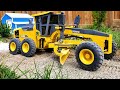 Grading a road with an rc motor grader in 116 scale
