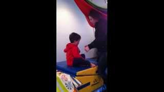Eli jumping into foam pit and climbing into swing, January 2013