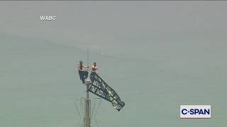 Masked Protesters Atop Empire State Building