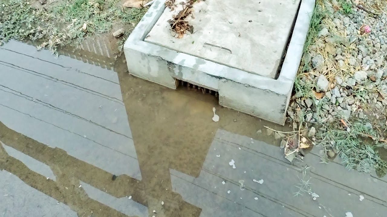 Unclogging Culvert Drain Rain Water On Street Road - YouTube