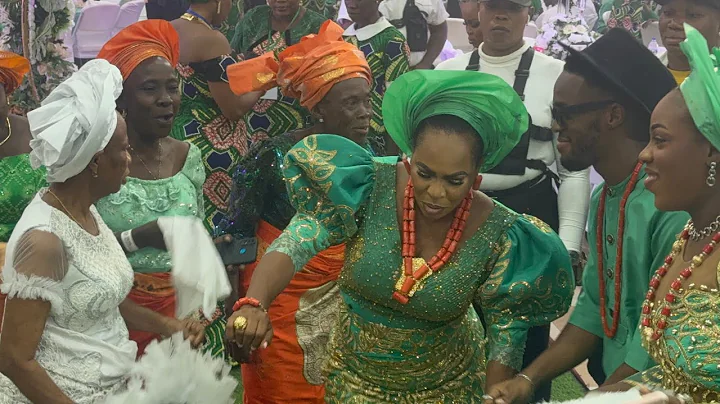 FAITHIA BALOGUN AND HER CHILDREN  DANCE AT HER FATHER’S BURIAL CEREMONY