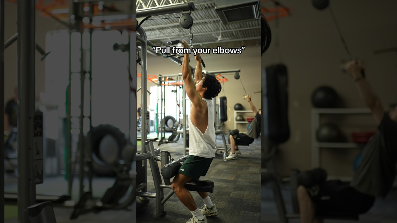 What “pull from your elbows” mean on a lat pulldown