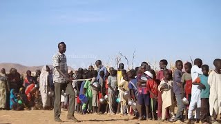 A Sudanese doctor recounts his harrowing escape from a Darfur city under rebel bombardment