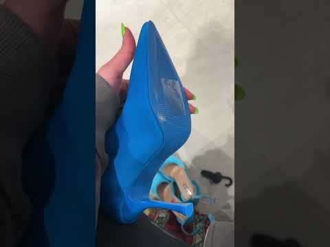 Trying on turquoise shoes in primark