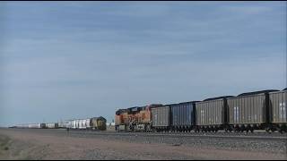BNSF Coal drag blowing by the Twin Eagle Sand load out facility south of Bill, WY.
