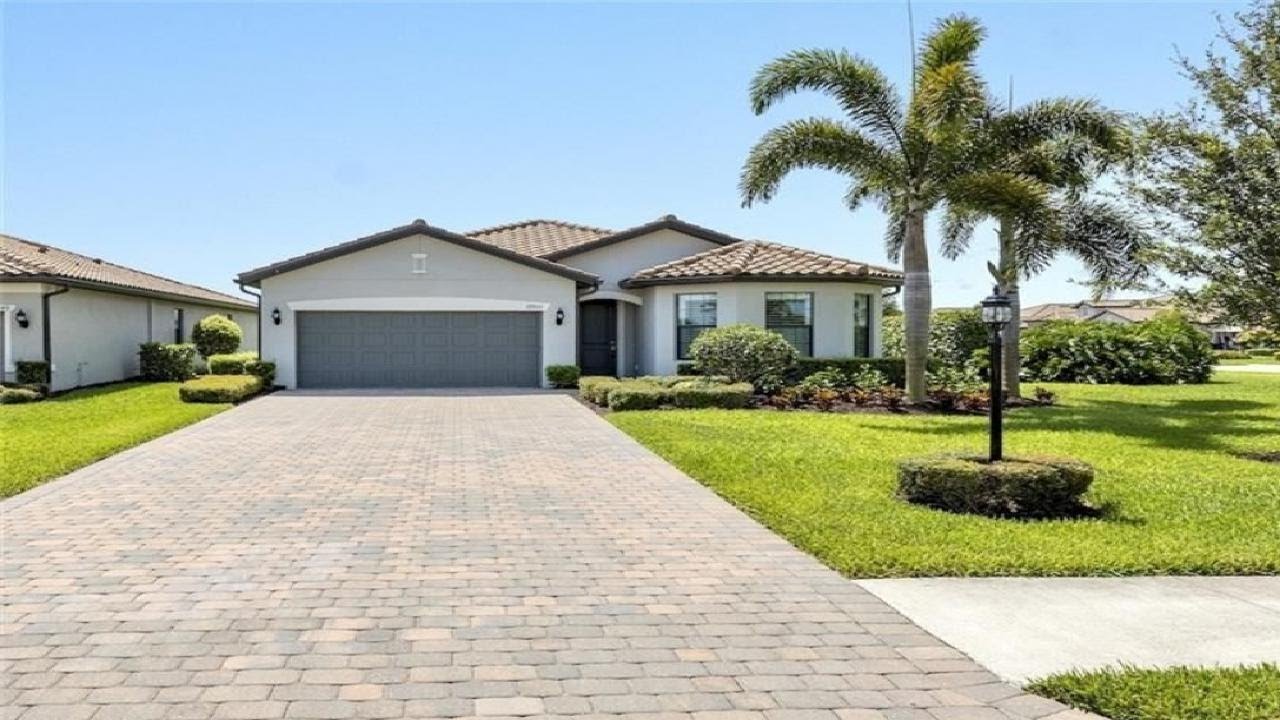 Estero Florida Home For Sale. Home by Pulte sits on an oversized double lot The Place At