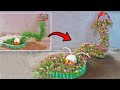 Unique worm-shaped flower garden with moss roses | Best flower pots from plastic bottles