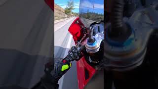 Experience the Thrill: Ride a Red Sportbike on Open Roads!
