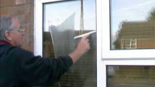 How to wash a window using a mop and squeegee