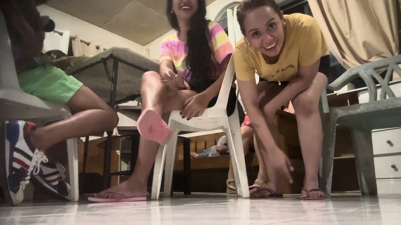 Asking my friend to dangle her flip flops