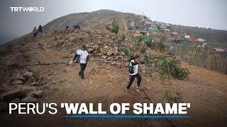 Workers begin dismantling wall symbolising Peru's class divisions