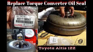 Replace oil seal from torque converter & clean transmission filter