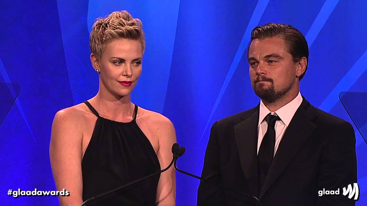 Charlize Theron and Leonardo DiCaprio present award to Steve Warren at the 