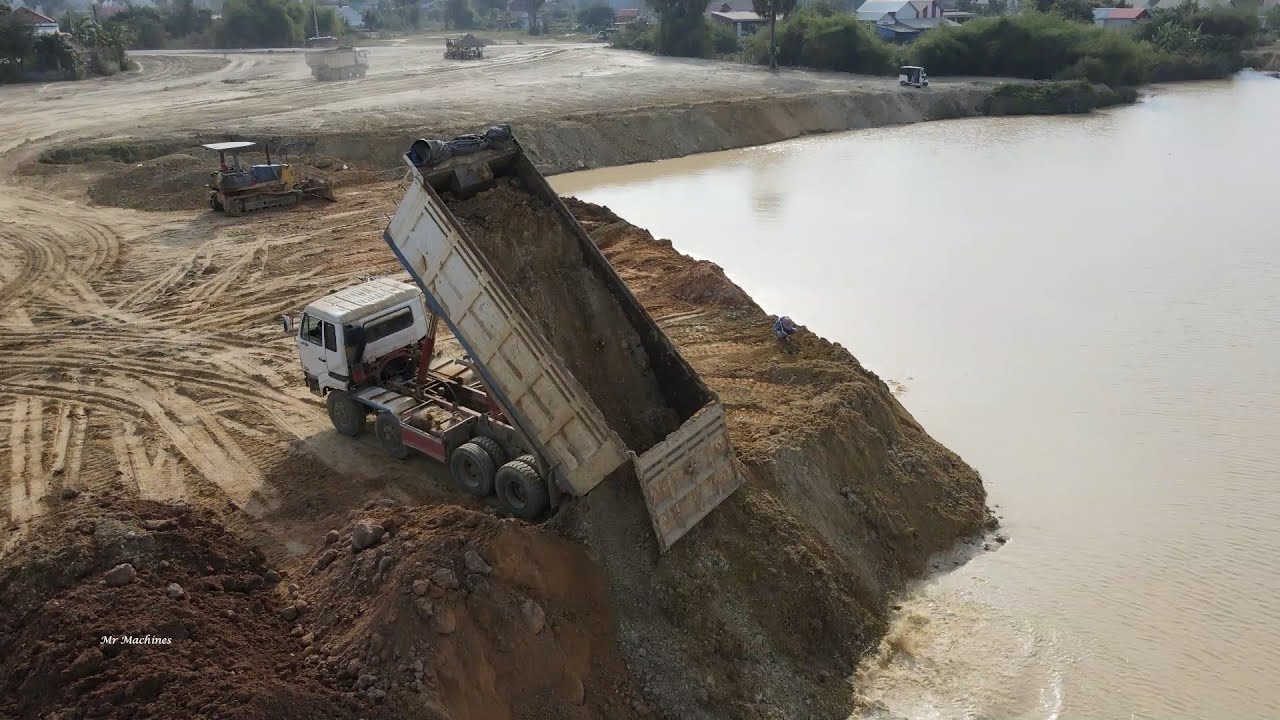 Best Absolute Dump Truck Spreading Dirt into Water on Land Filling and ...