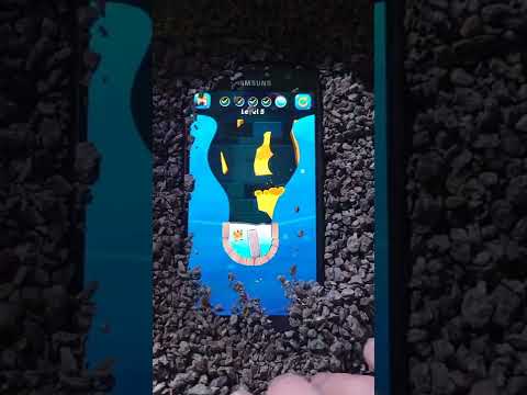 digging a mobile phone out of sand - dig fish gameplay