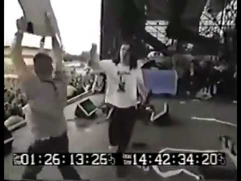 Gibby from the butthole surfers shoots blanks from a shotgun over Lollapalooza