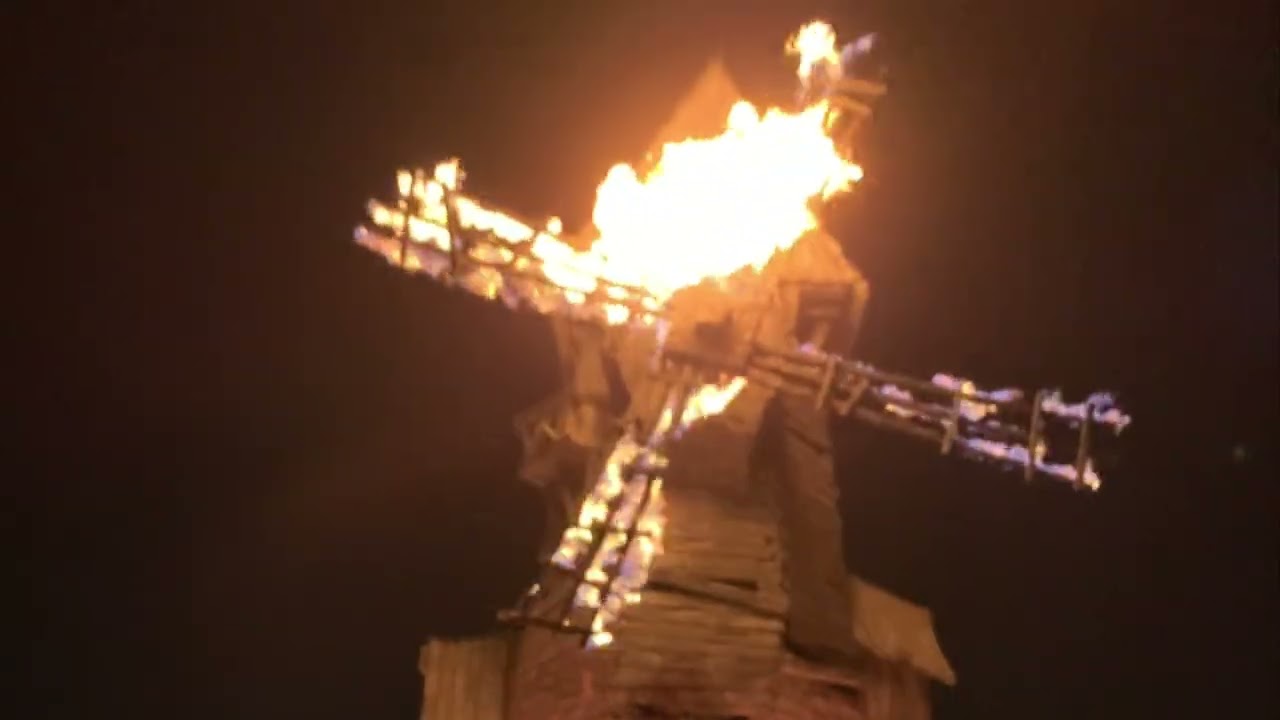 The old mill burning above The Burning Blade Tavern at Dark Universe Epic Universe
