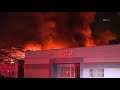Firefighters battle a large commercial structure fire in South El Monte, California.