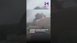 Delivery Driver Caught on Camera Reacting to Massive Lightning Strike