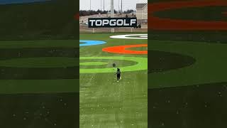 Boy runs through golf range at Top Golf while Mom chases him