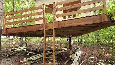 How to Build a Treehouse Part 3: Treehouse framed, tin roof installed, and walls paneled