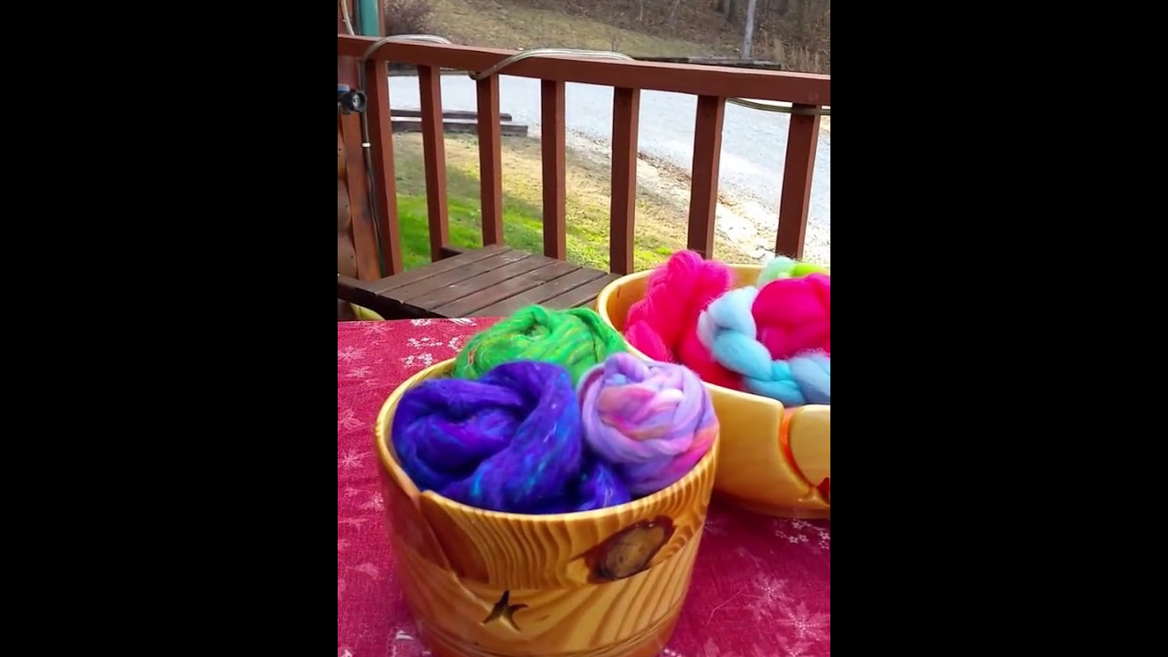 Eve Starr Fiber Arts Ozarks Spinning upcycled Sari silk outdoors on a perfect spring afternoon.