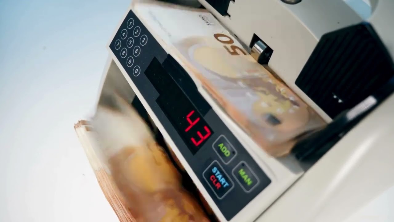 VideoVault Stock Video: Money counting machine counts 50 euro bills