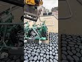 Installation of black coral stones in housing complex yard using heavy equipment #shorts