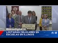 JB Pritzker promulga ley que prohíbe celulares en las escuelas de Illinois